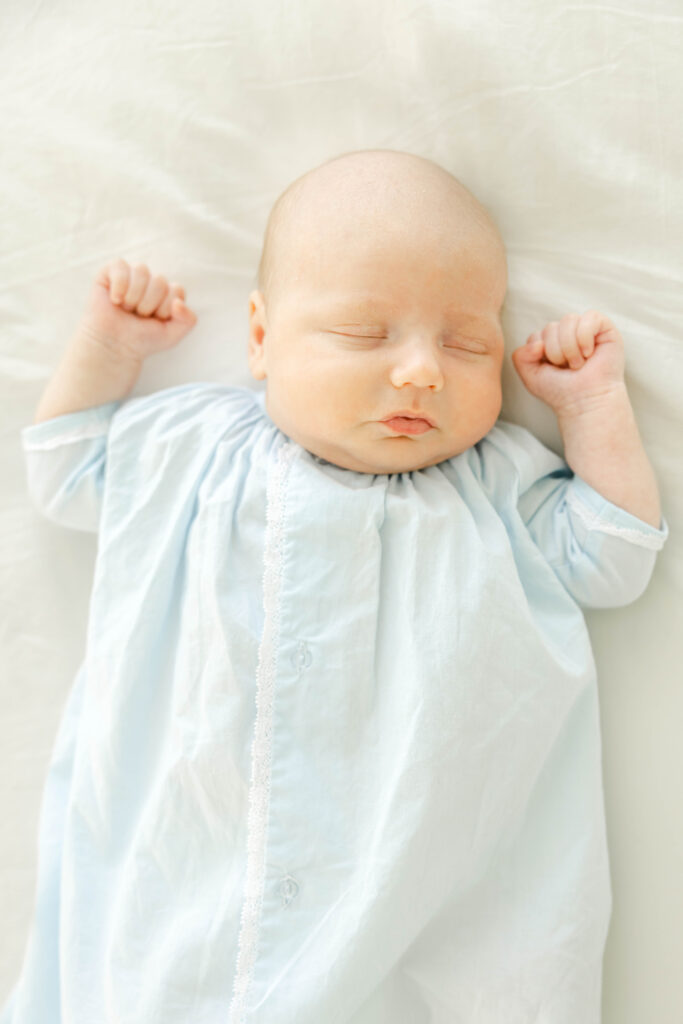 Sleeping newborn baby boy in blue daygown by Birmingham Newborn Photographer