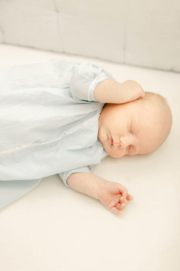 Baby sleeping in crib by Birmingham Newborn Photographer