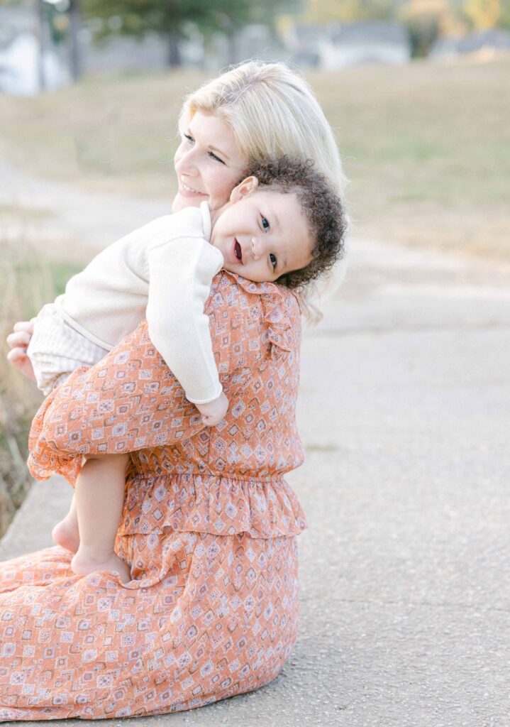 Toddler lying head on Mom's shoulder, lifestyle family photography - Whitney Carr Photography