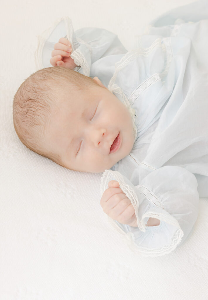 Close up shot of newborn smiling in lifestyle session